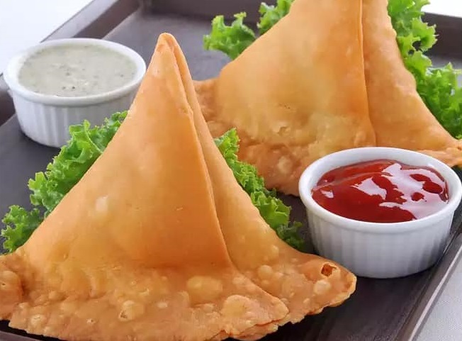 Crispy Vegetable Samosa — spiced potato and pea filling, Taj Mahal Saskatoon